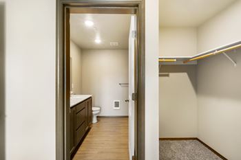 the view of a bathroom from the doorway of a living room with a door open at Altitude, Washington